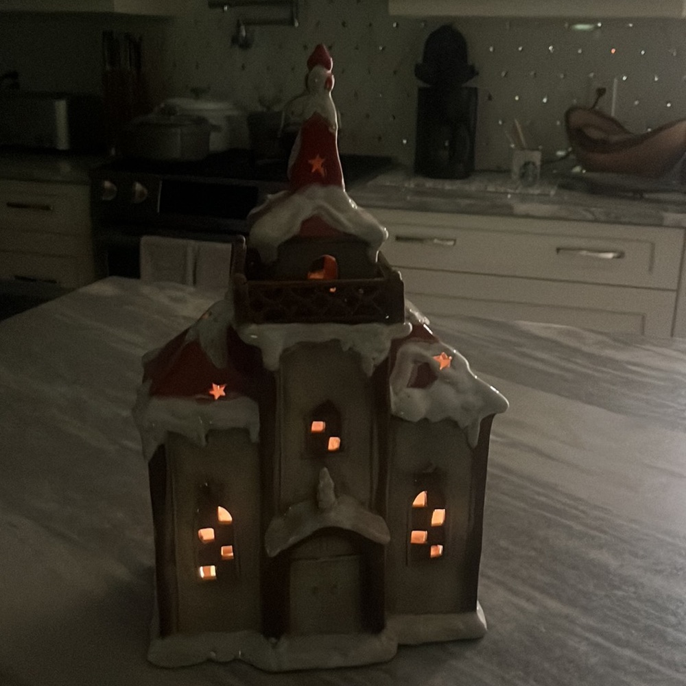 9 by 15 glazed pottery Christmas church lit by tea lites fabulous and large